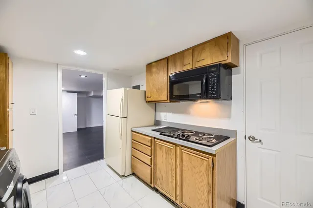 a kitchen with stainless steel appliances a stove a microwave and a refrigerator