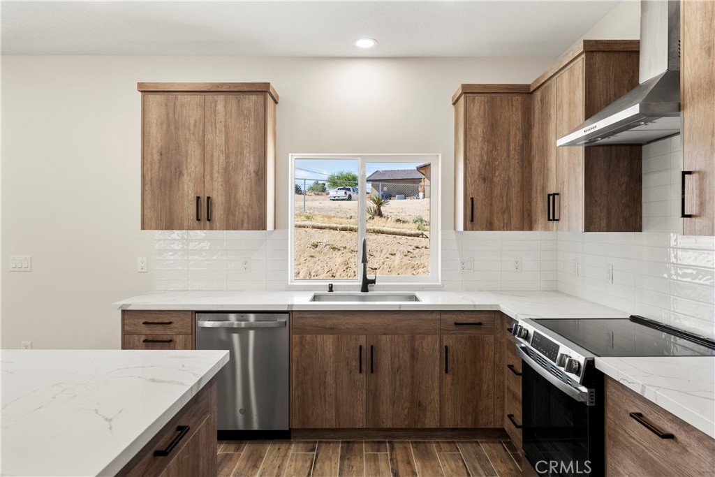 22324 Rancho Street Apple Valley, CA 92308 - Photo 20 of 47 a kitchen with a sink and a window