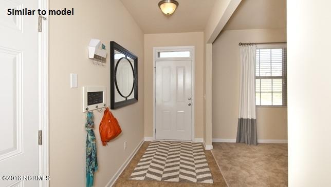 46 Rochester Street, Unit LOT 49 Hampstead, NC 28443 - Photo 4 of 27 The actual front door is an 8ft. glass door