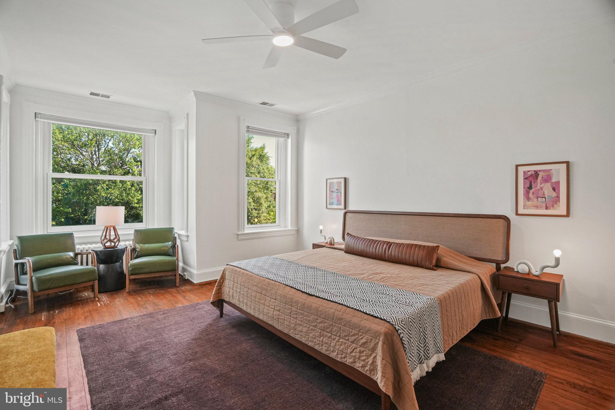 655 F Street Northeast Washington, DC 20002 - Photo 11 of 24 a bedroom with a bed and a couch