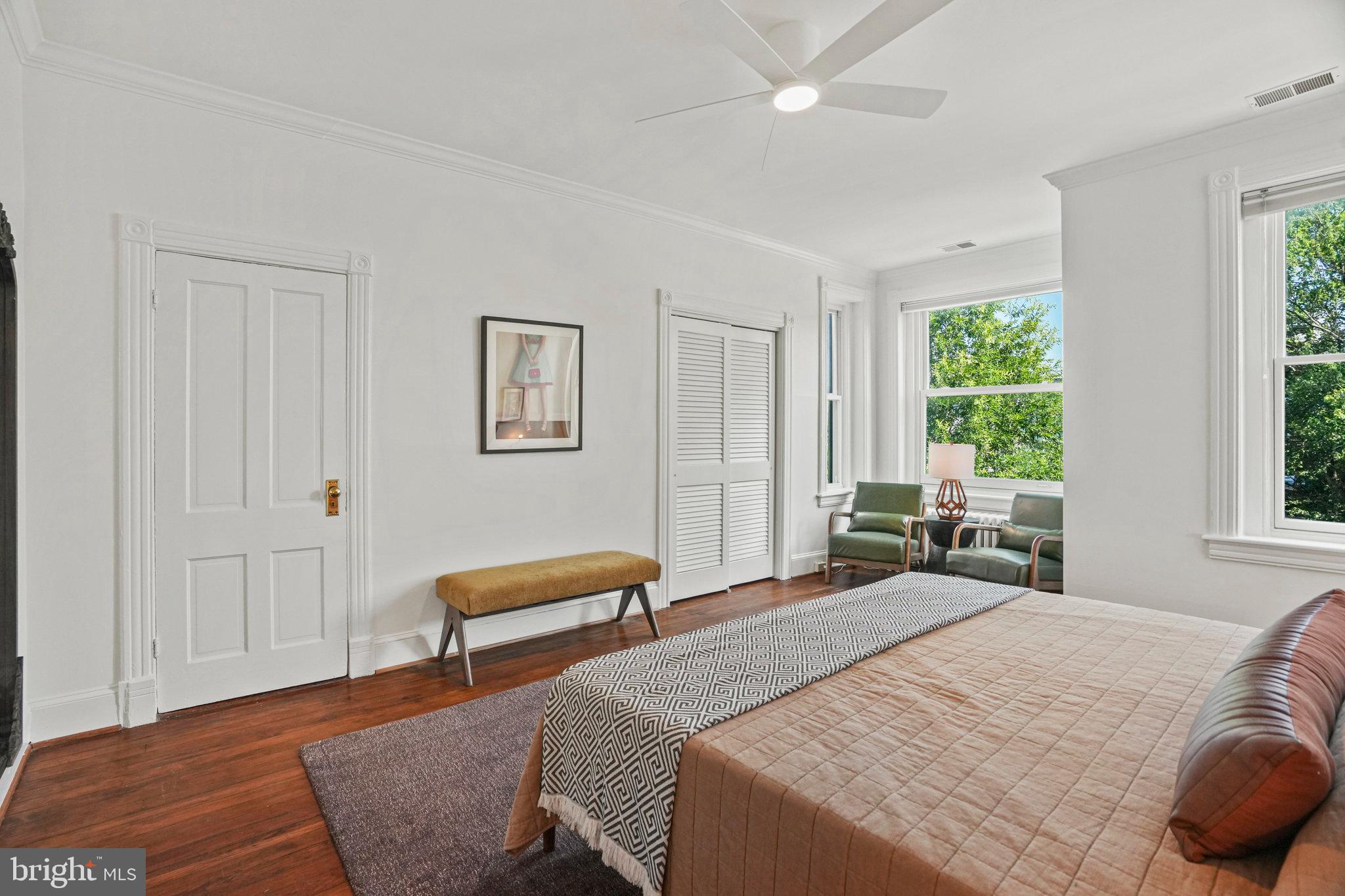 655 F Street Northeast Washington, DC 20002 - Photo 12 of 24 a bedroom with a bed and wooden floor
