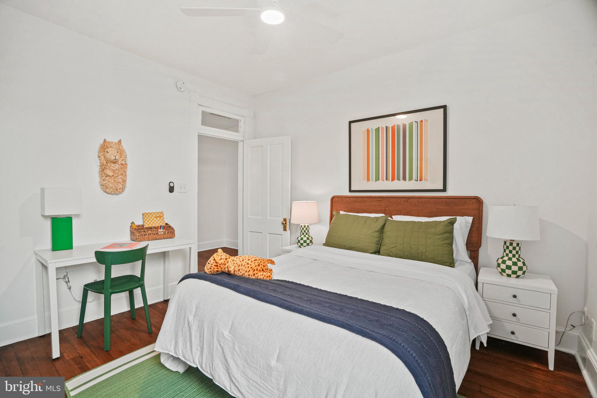 655 F Street Northeast Washington, DC 20002 - Photo 13 of 24 a bedroom with a bed and a table in it