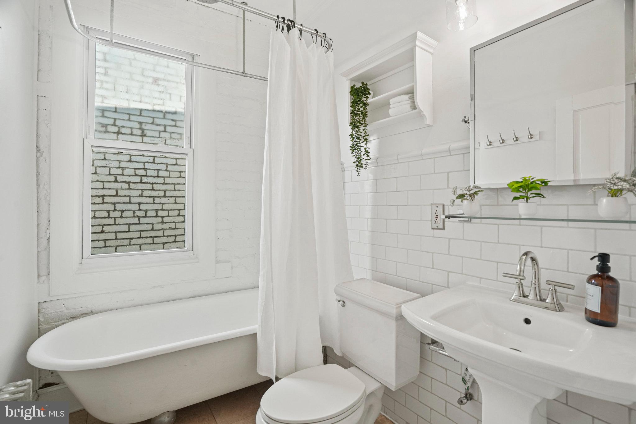655 F Street Northeast Washington, DC 20002 - Photo 15 of 24 a bathroom with a sink toilet and shower