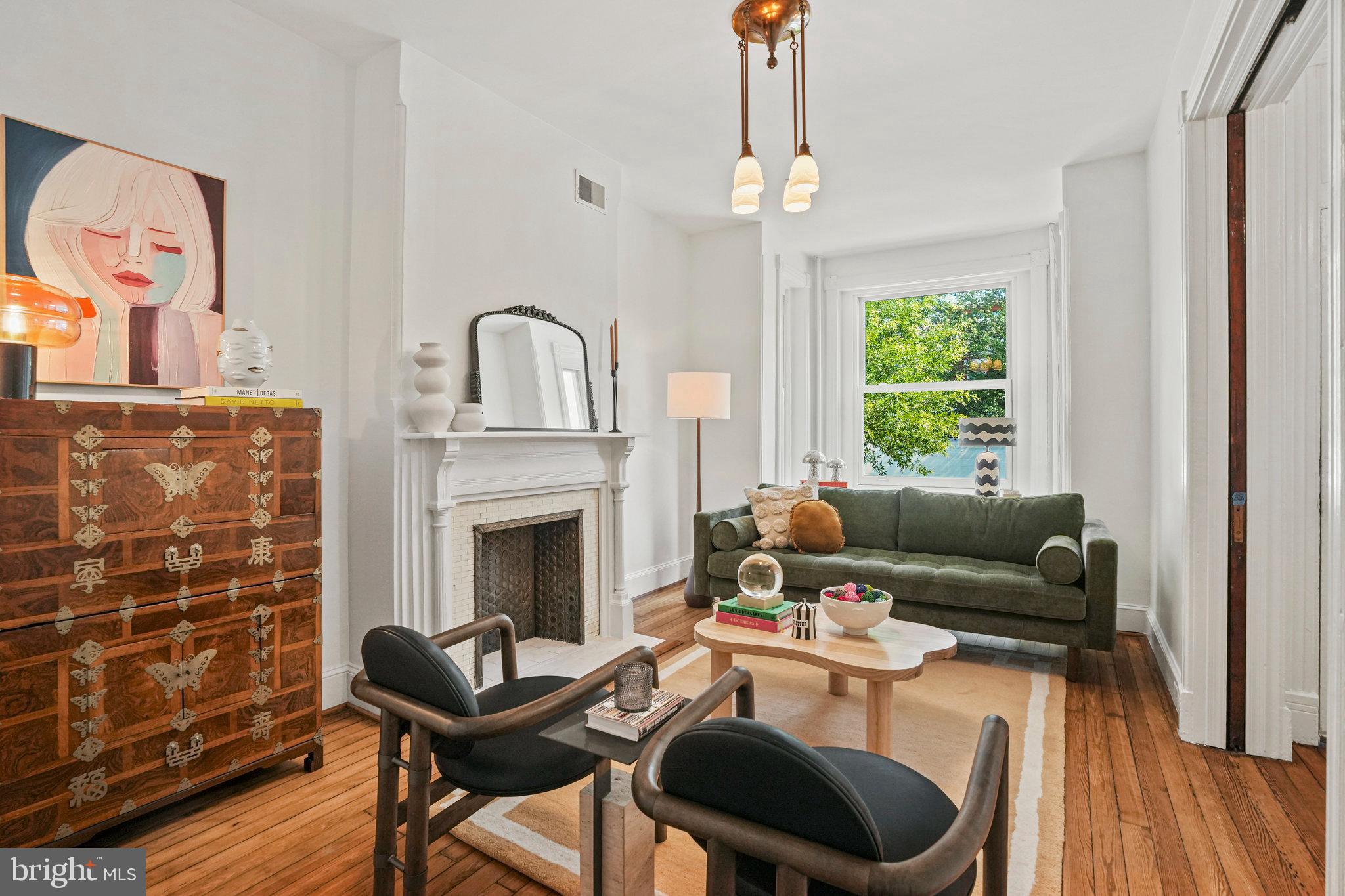 655 F Street Northeast Washington, DC 20002 - Photo 2 of 24 a living room with furniture and a fireplace