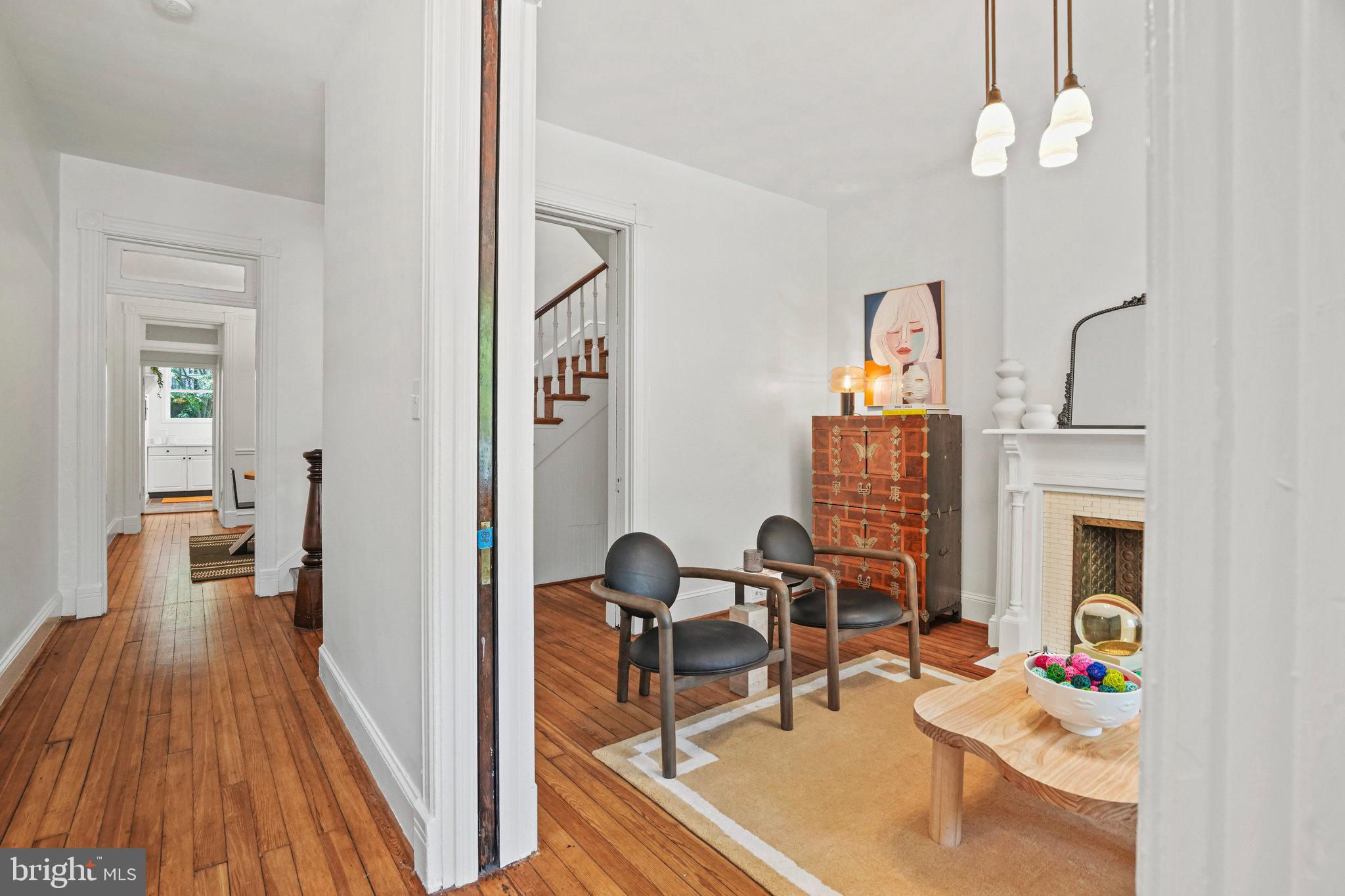 655 F Street Northeast Washington, DC 20002 - Photo 4 of 24 a view of a workspace with furniture and a kitchen
