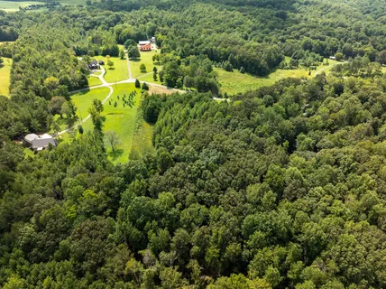 a view of a house with a street park