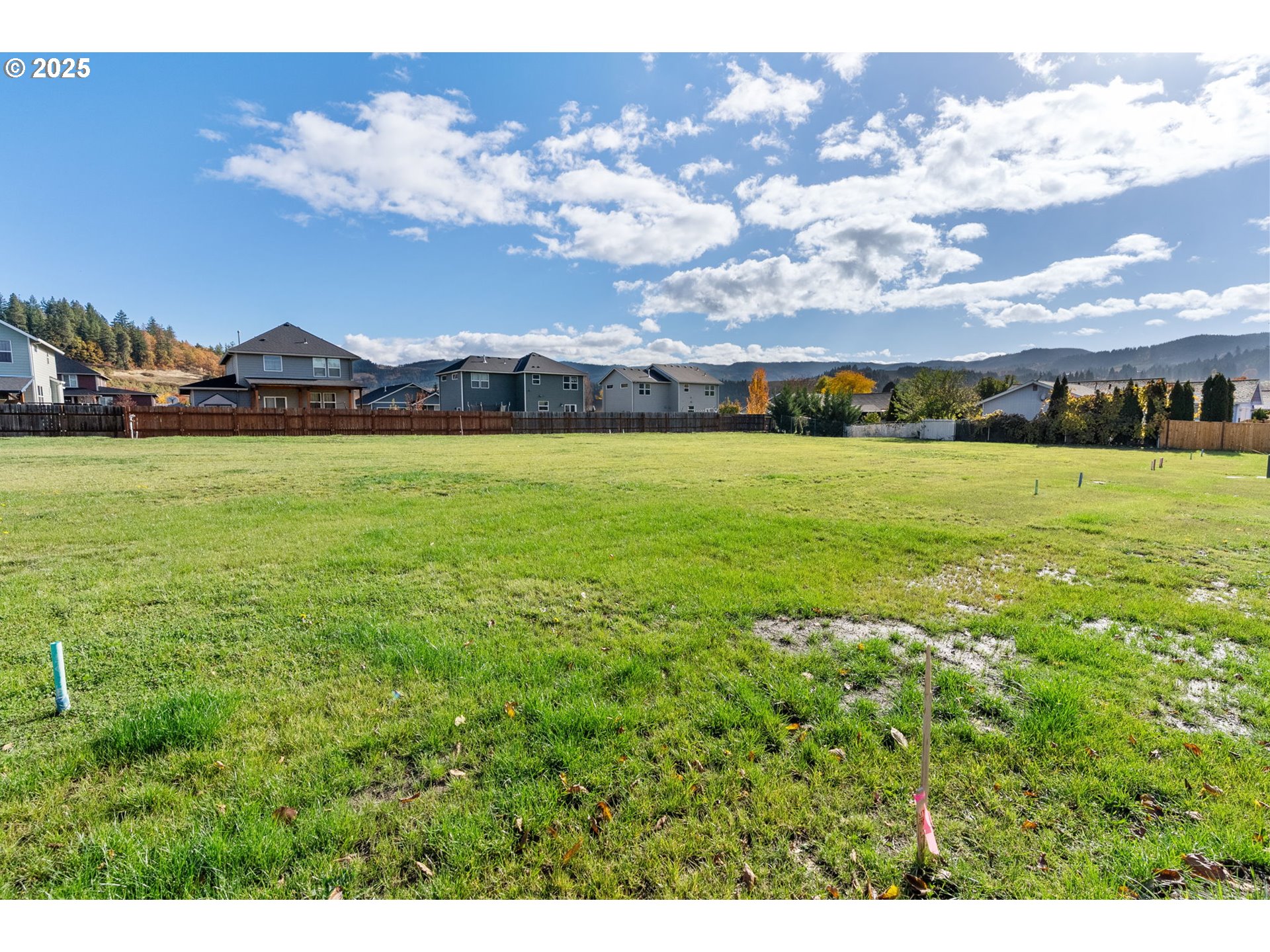 3165 Maple Road Hood River, OR 97031 - Photo 1 of 20 a view of an houses with yard and mountain view in back