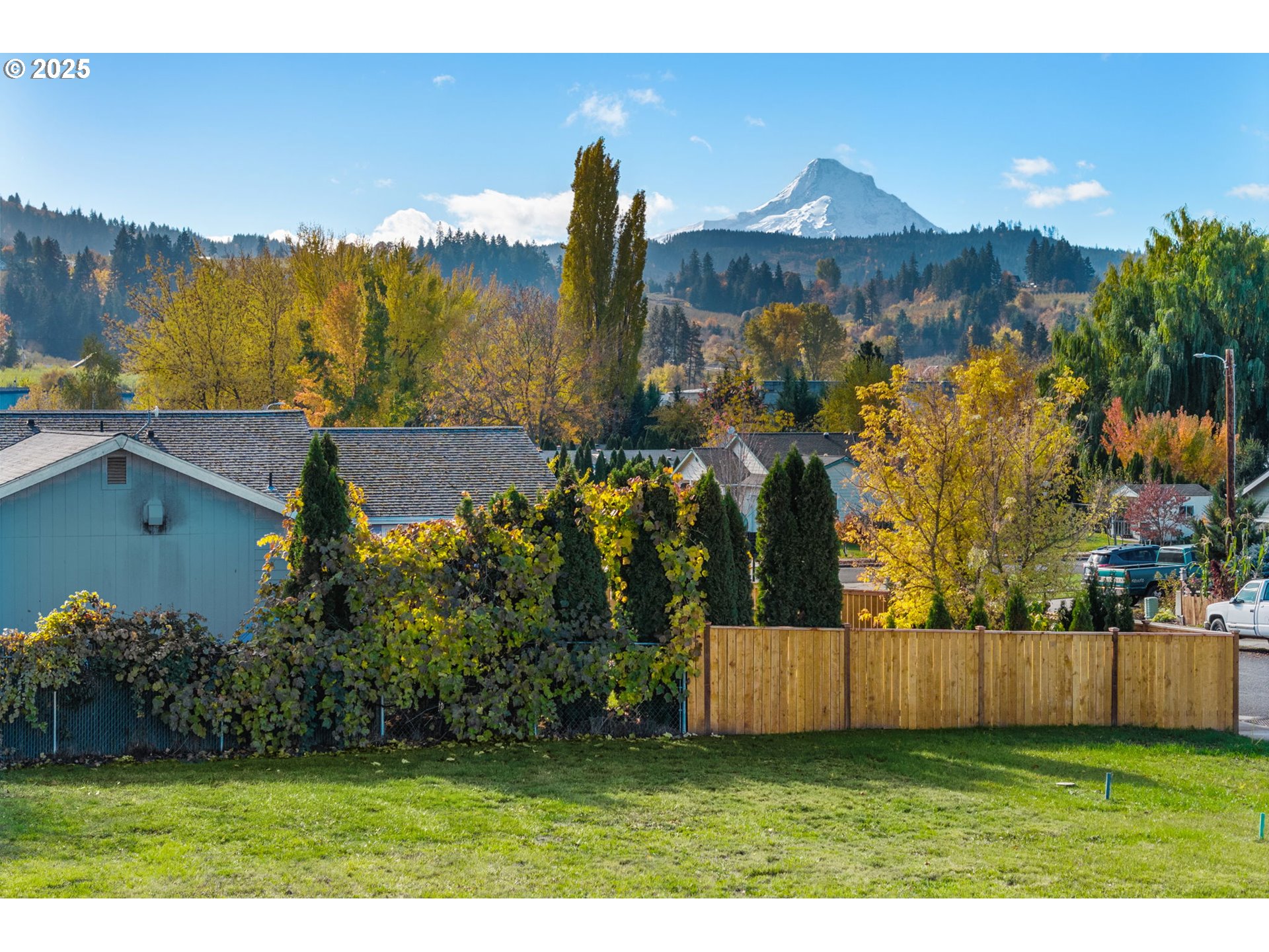 3165 Maple Road Hood River, OR 97031 - Photo 13 of 20 a view of a house with a yard and wooden fence