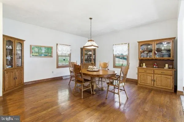 a dining room with furniture window wooden floor