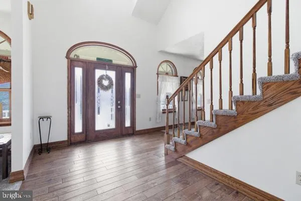 a view of staircase with wooden floor and stairs