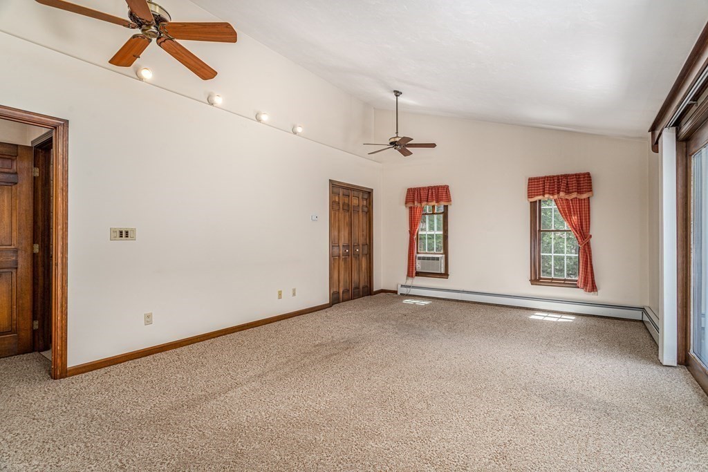 266 Worcester Road Princeton, MA 01541 - Photo 8 of 35 an empty room with windows and fan
