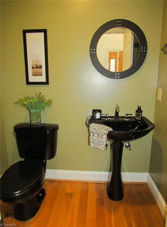 7232 Ledbetter Road Climax, NC 27233 - Photo 20 of 33 Main Level Half Bath With Black Pedestal Sink & Toilet