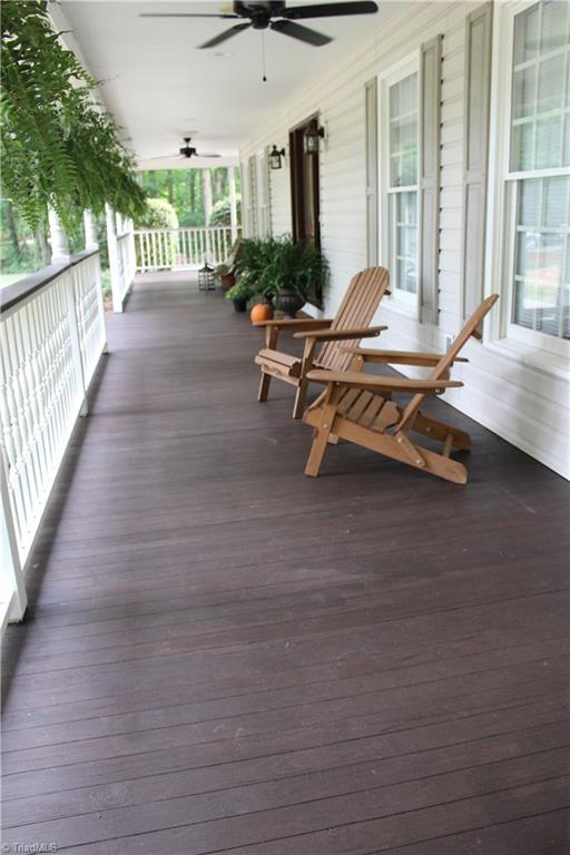 7232 Ledbetter Road Climax, NC 27233 - Photo 6 of 33 Massive Wrap Around Front Porch Is Where You Will Enjoy Beautiful Days & Evenings Relaxing or In Great Conversation With Family & Friends