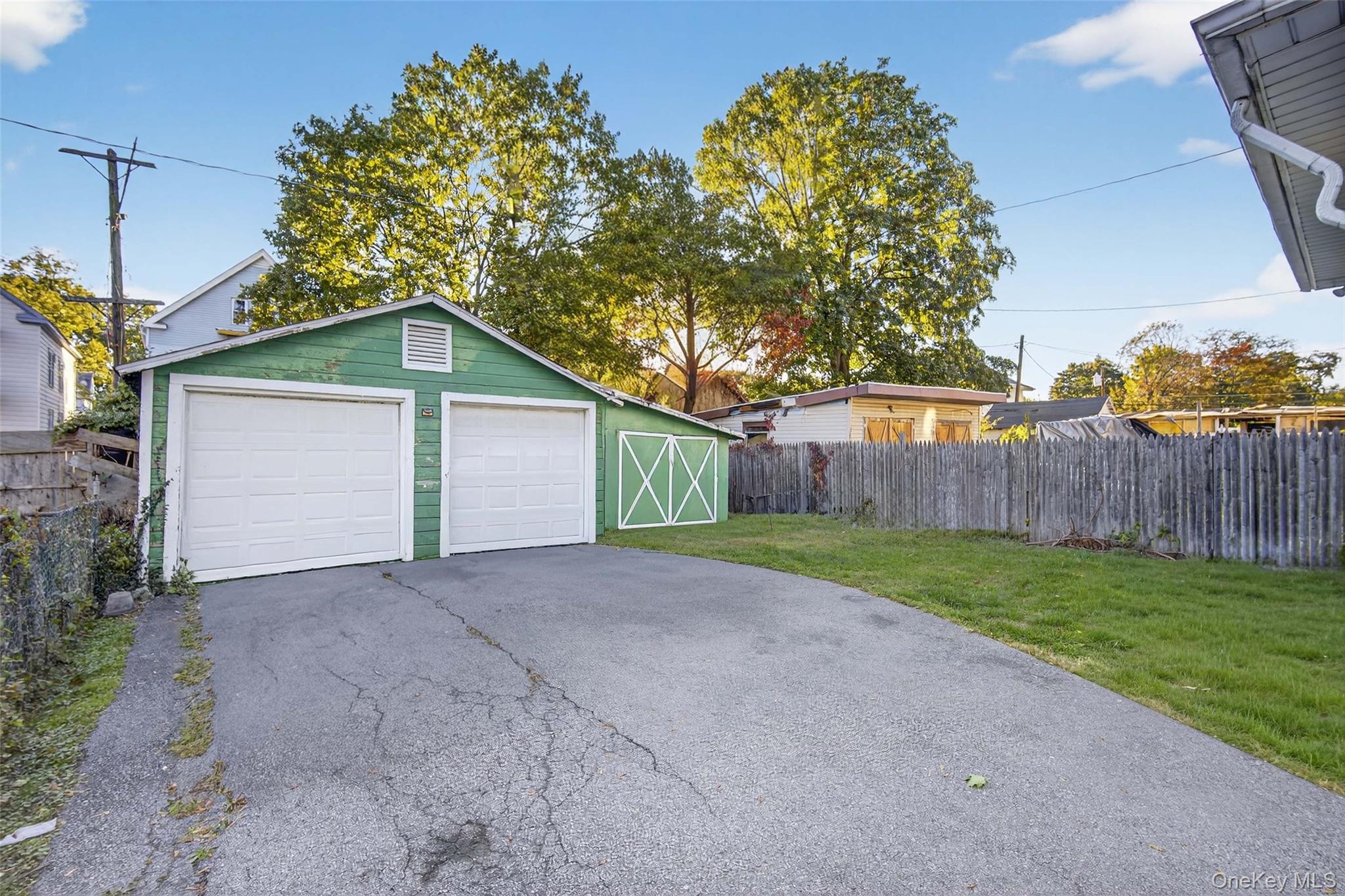 60 Lent Street Poughkeepsie, NY 12601 - Photo 11 of 16 a view of a house with a yard and large tree