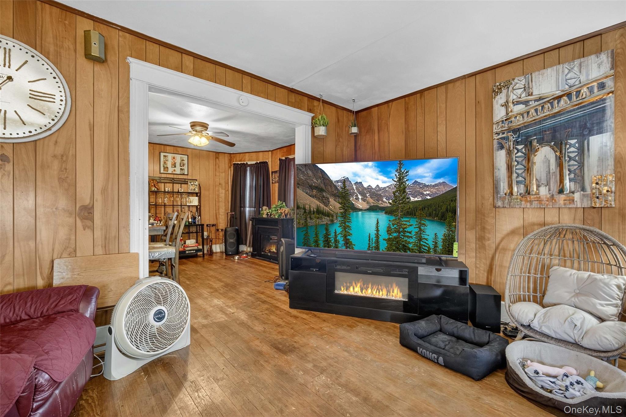 60 Lent Street Poughkeepsie, NY 12601 - Photo 4 of 16 a living room with furniture a fireplace and a large window