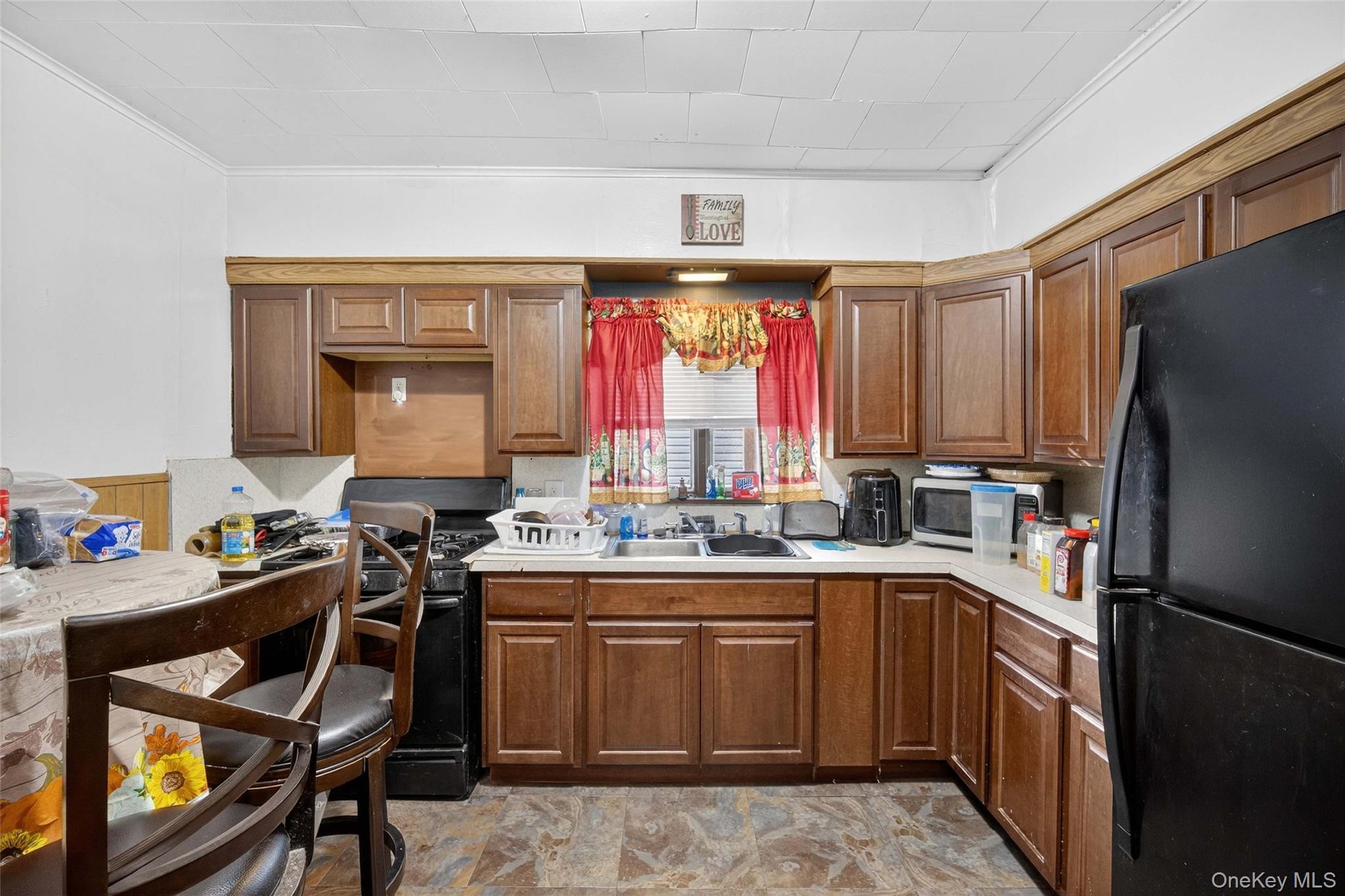 60 Lent Street Poughkeepsie, NY 12601 - Photo 5 of 16 a kitchen with a sink stove and refrigerator