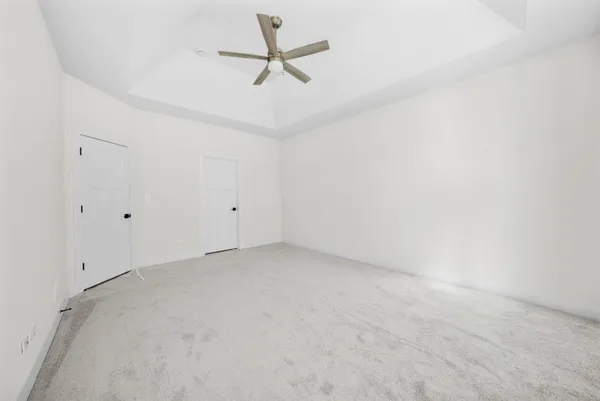 a view of a big room with carpet