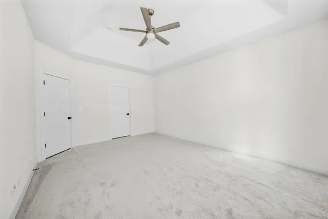 a view of a big room with carpet