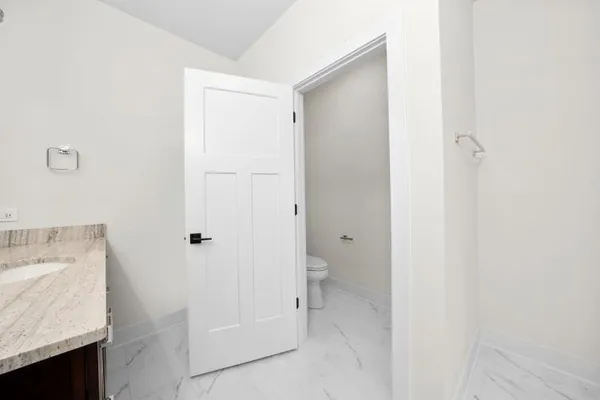 a bathroom with a sink and toilet