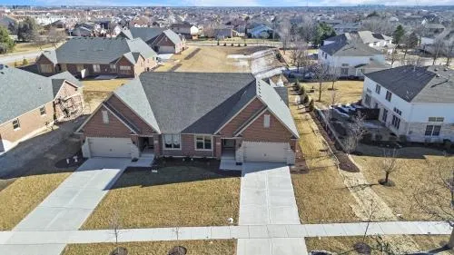 an aerial view of a house with a swimming pool