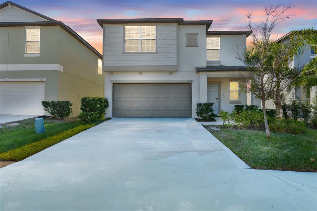 9913 Jackfruit Court Riverview, FL 33578 - Photo 1 of 57 a front view of a house with a yard and garage