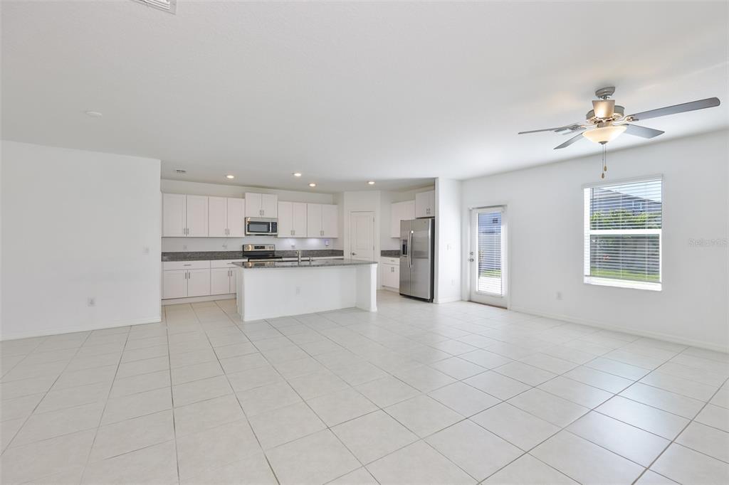 9913 Jackfruit Court Riverview, FL 33578 - Photo 13 of 57 a view of kitchen with white cabinets and appliances