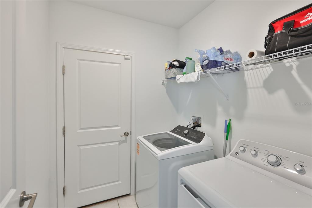 9913 Jackfruit Court Riverview, FL 33578 - Photo 15 of 57 a utility room with dryer and washer