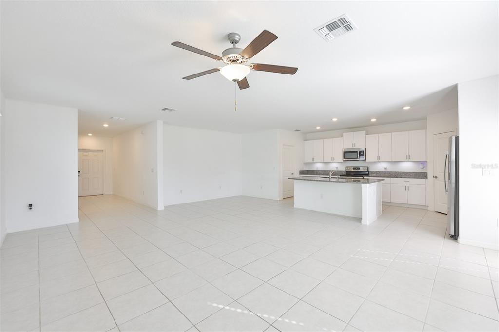 9913 Jackfruit Court Riverview, FL 33578 - Photo 17 of 57 a view of kitchen with white cabinets