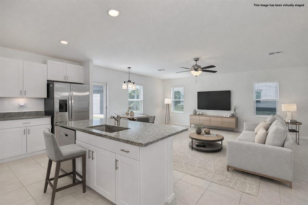 9913 Jackfruit Court Riverview, FL 33578 - Photo 19 of 57 a living room with furniture and a flat screen tv