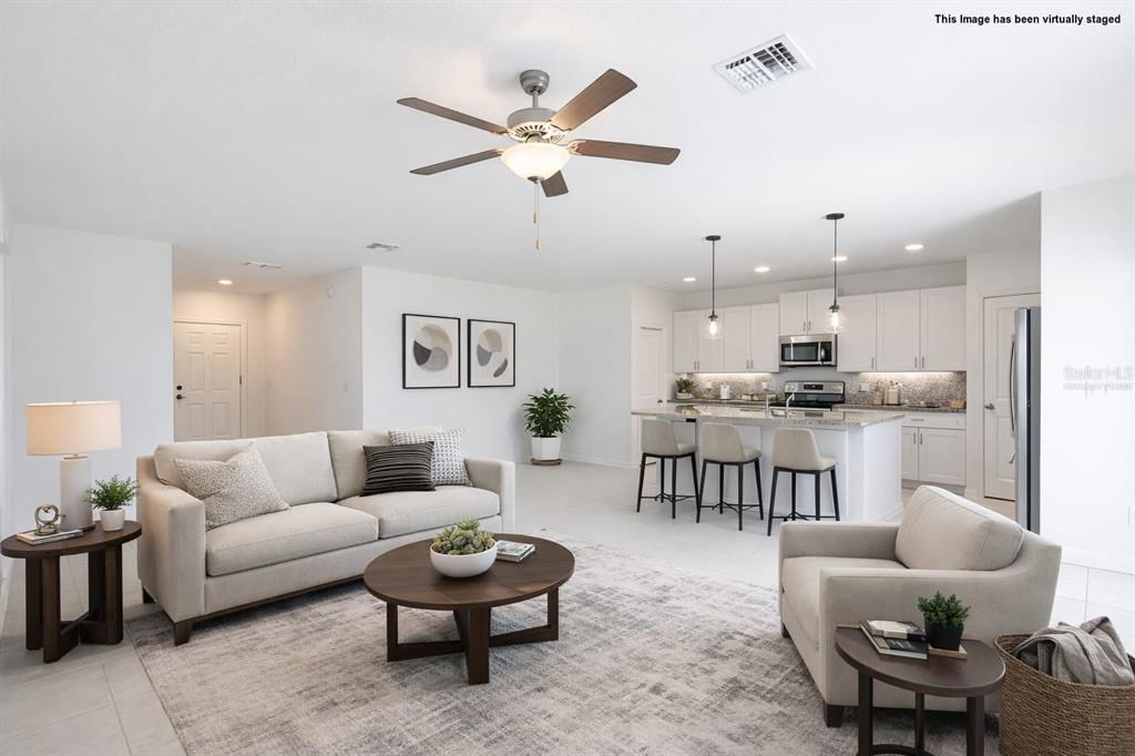 9913 Jackfruit Court Riverview, FL 33578 - Photo 20 of 57 a living room with furniture and kitchen view