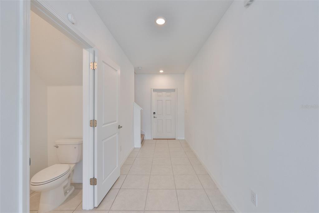 9913 Jackfruit Court Riverview, FL 33578 - Photo 21 of 57 a bathroom with a granite countertop sink a toilet and a shower