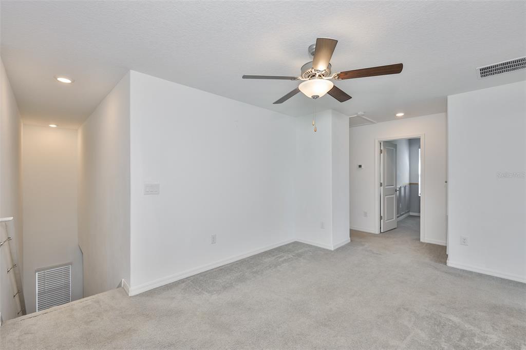 9913 Jackfruit Court Riverview, FL 33578 - Photo 22 of 57 a view of empty room with a ceiling fan