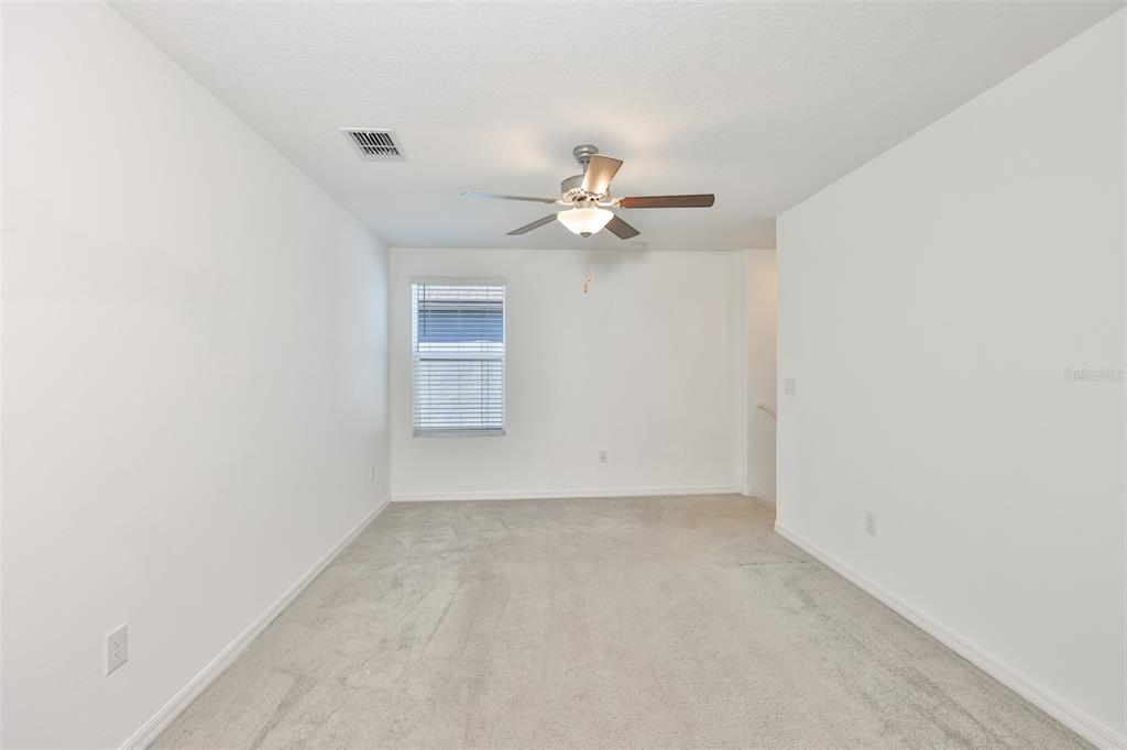 9913 Jackfruit Court Riverview, FL 33578 - Photo 24 of 57 a view of a chandelier fan in a room