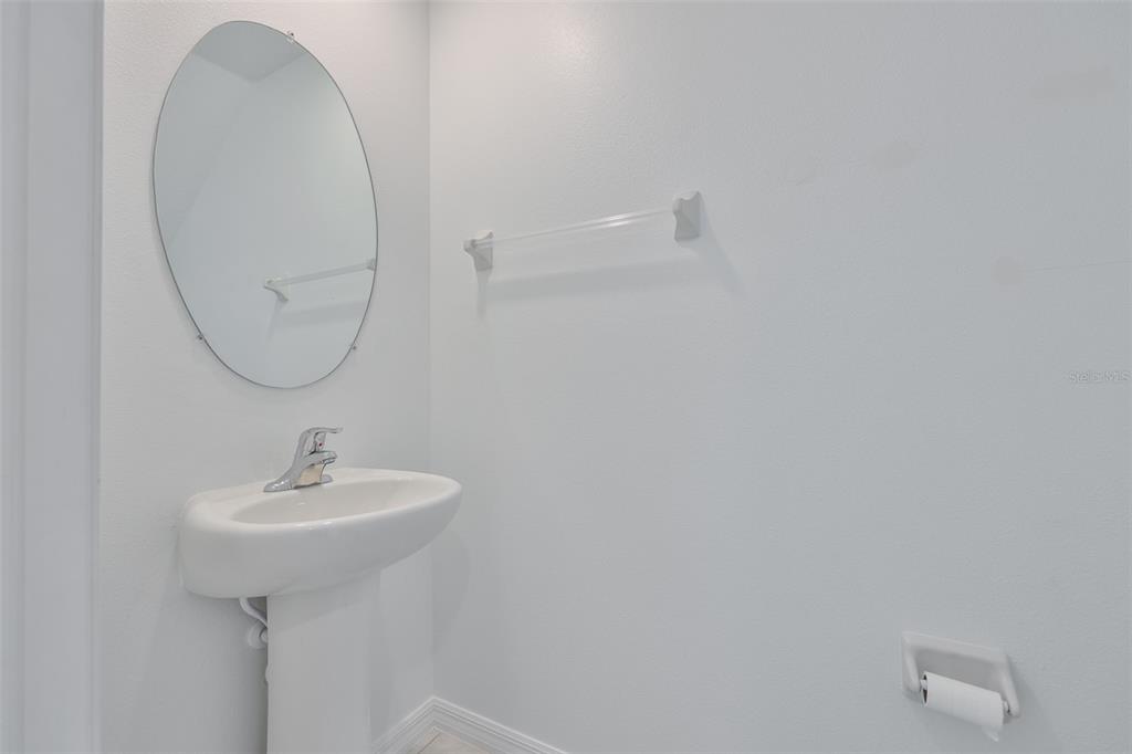 9913 Jackfruit Court Riverview, FL 33578 - Photo 35 of 57 a bathroom with a sink a mirror and a shower