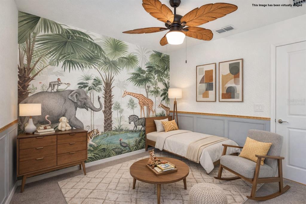 9913 Jackfruit Court Riverview, FL 33578 - Photo 43 of 57 a living room with furniture and a chandelier