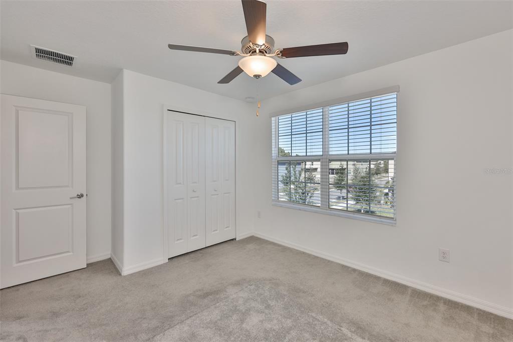 9913 Jackfruit Court Riverview, FL 33578 - Photo 45 of 57 a view of an empty room with a window