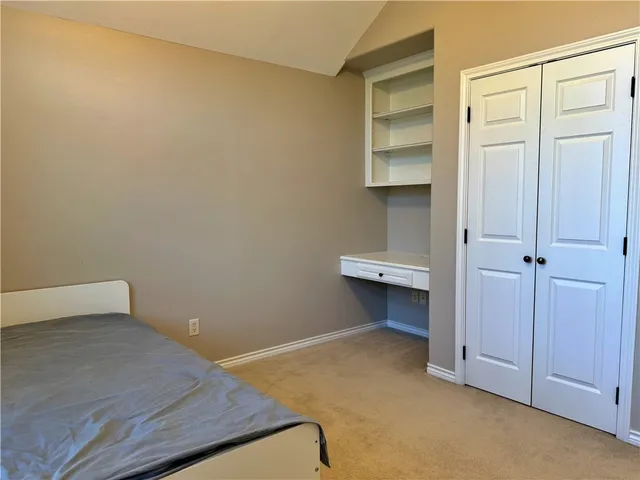 an empty room with a bench