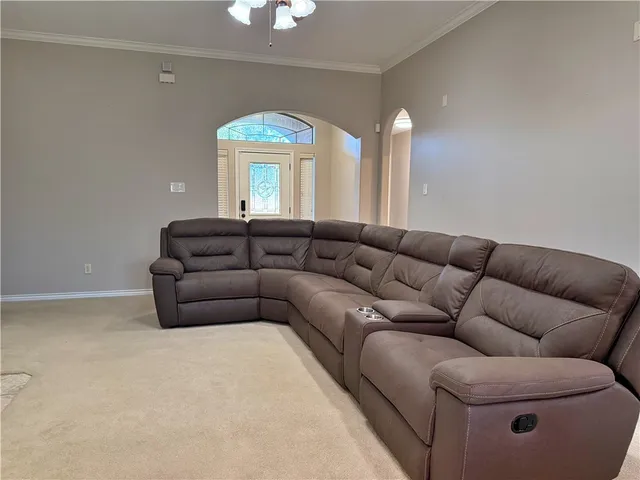 a living room with furniture a lamp and a fireplace