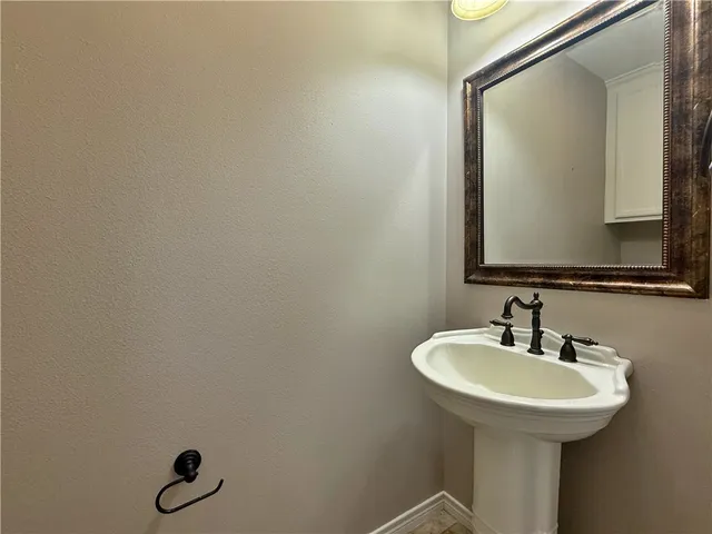 a bathroom with a sink and mirror