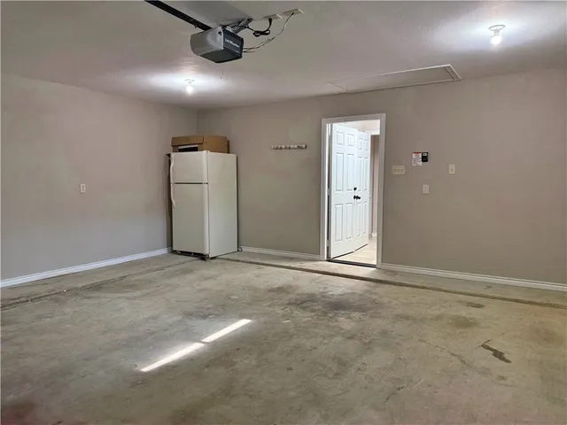 an empty room with a empty space and windows