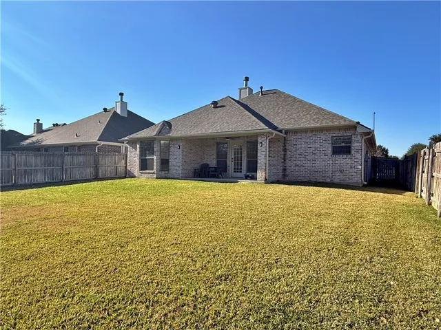 a front view of a house with a outdoor space