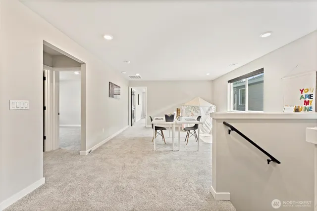 a view of a livingroom with furniture and a window