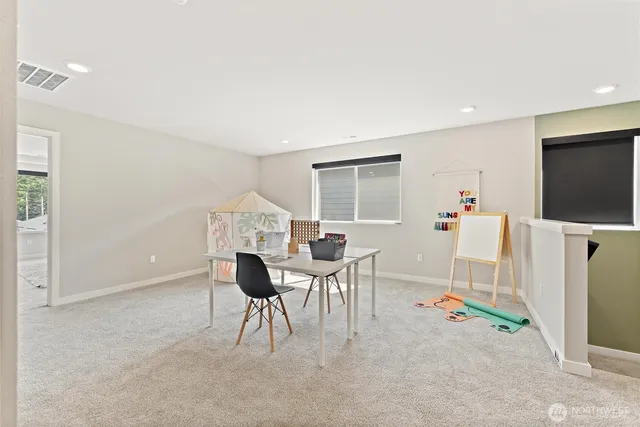 a view of a livingroom with furniture and a flat screen tv