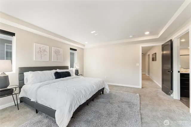 a bedroom with a bed and a couch