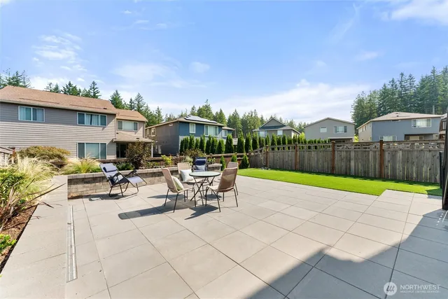 a view of a backyard with sitting area