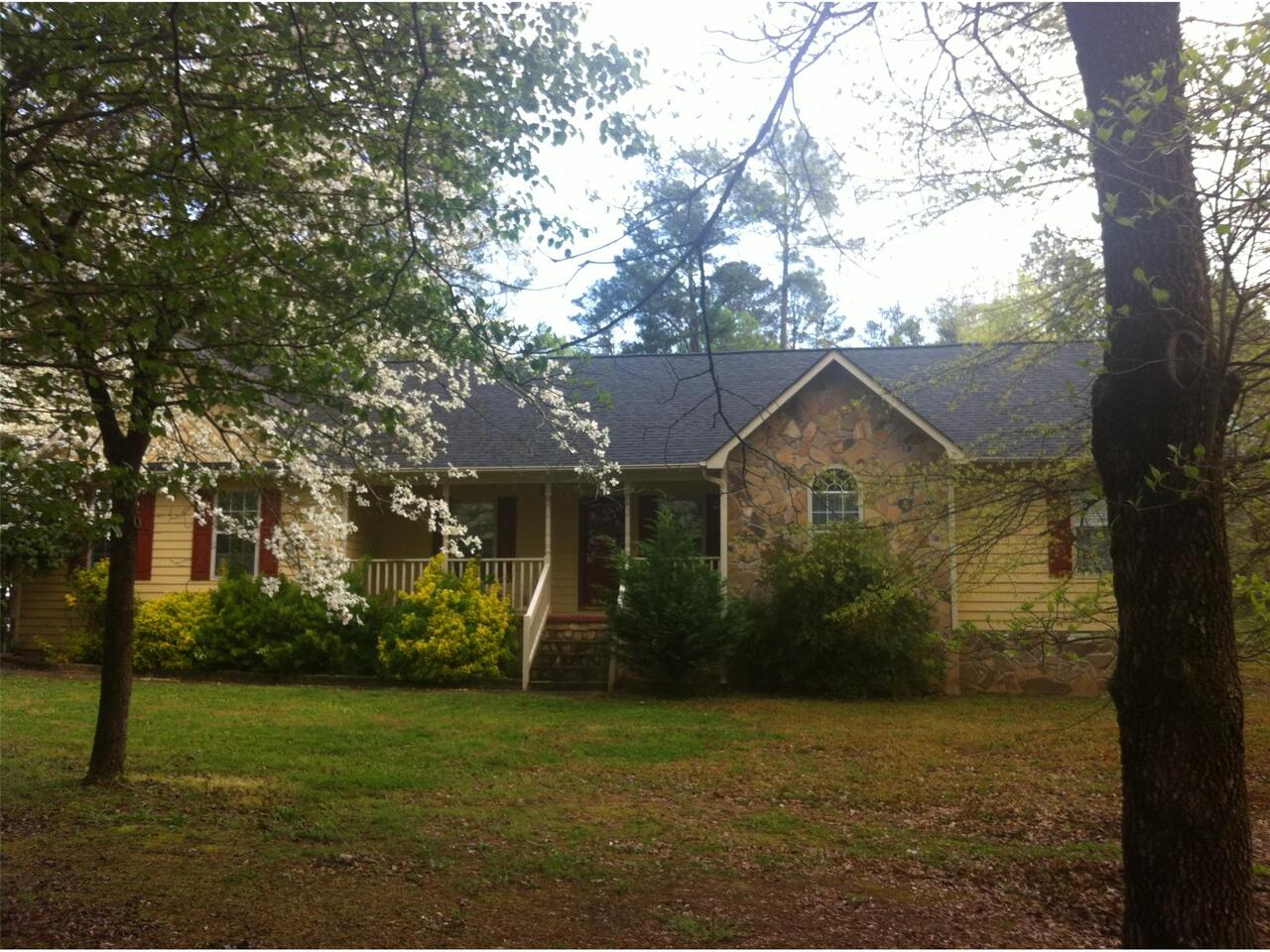 253 Mount Vernon Road Northwest Monroe, GA 30655 - Photo 1 of 1 a front view of house with a garden