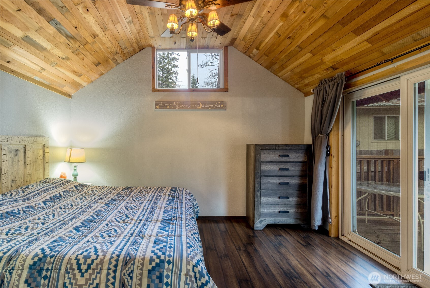 48 Blue Jay Loop Walla Walla, WA 99362 - Photo 12 of 21 a bedroom with a bed and a chandelier