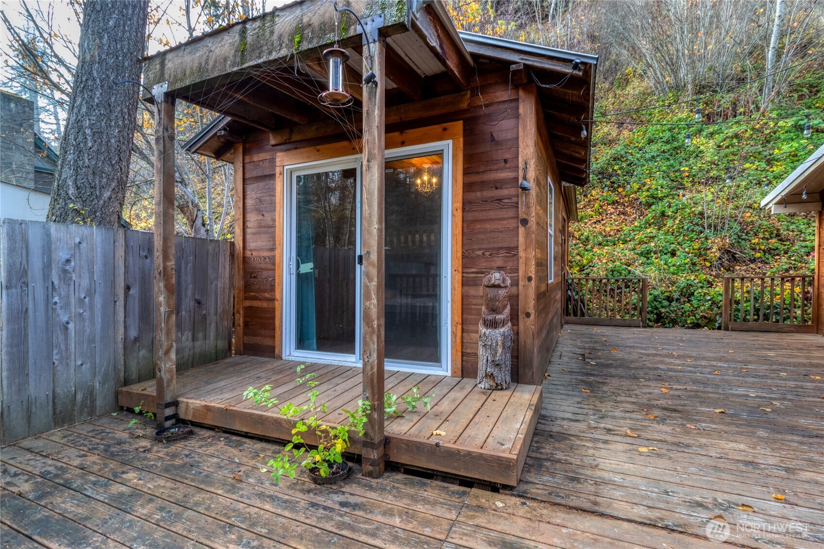 48 Blue Jay Loop Walla Walla, WA 99362 - Photo 19 of 21 a view of wooden house with a small yard and wooden floor and fence