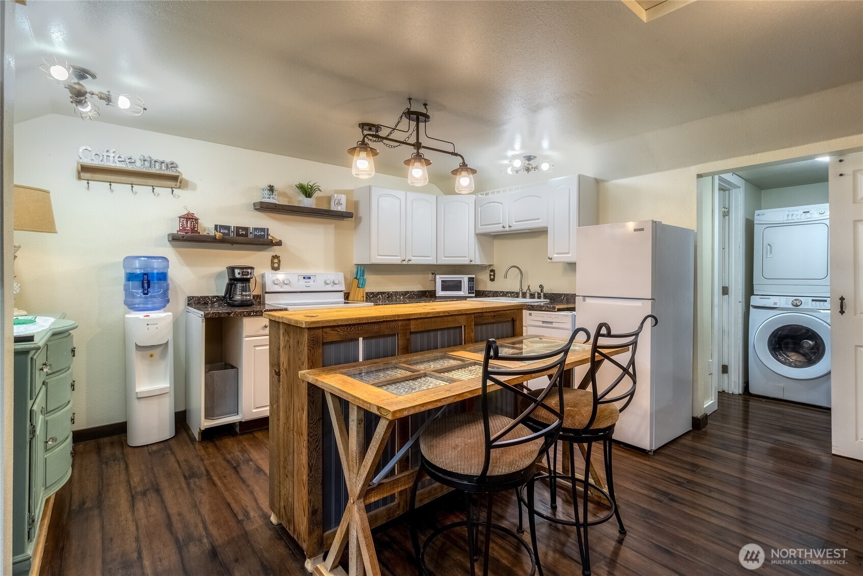 48 Blue Jay Loop Walla Walla, WA 99362 - Photo 7 of 21 a kitchen with a table chairs refrigerator and microwave