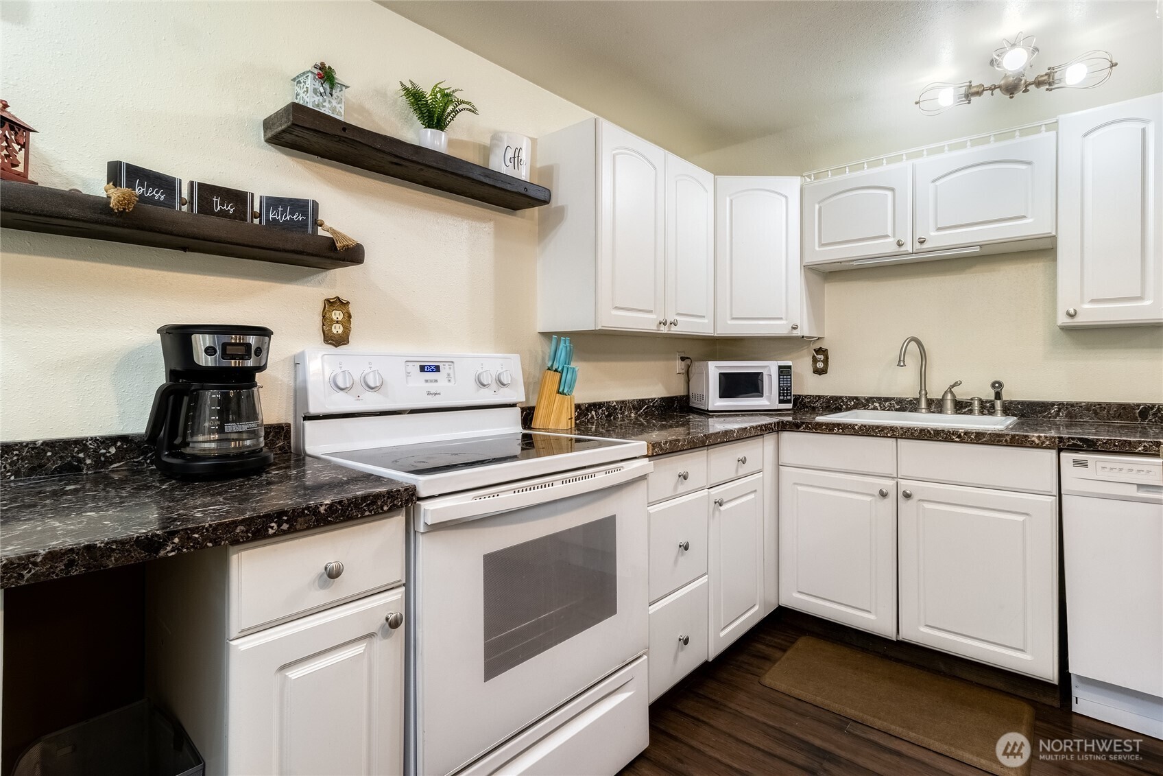48 Blue Jay Loop Walla Walla, WA 99362 - Photo 8 of 21 a kitchen with stainless steel appliances granite countertop a sink stove and cabinets